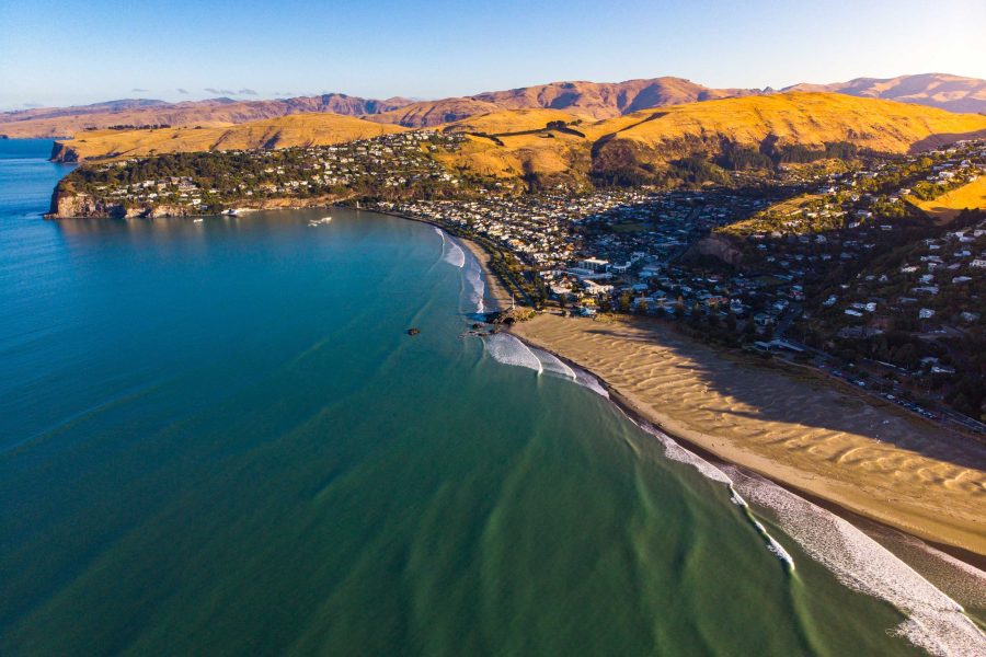Town on a bay and headland with a long beach, representing local government